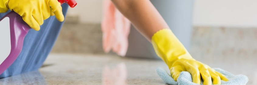 person cleaning kitchen
