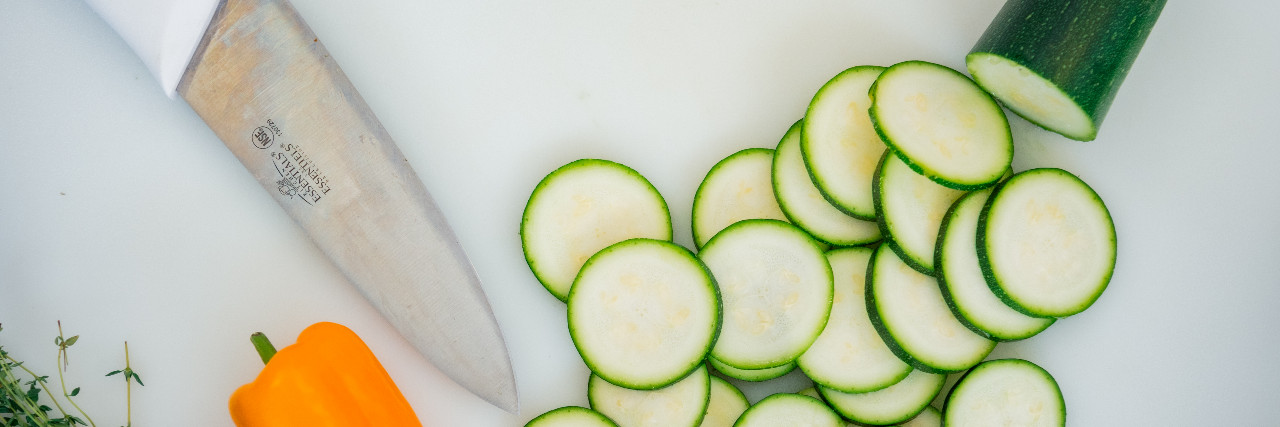 knife and sliced cucumber